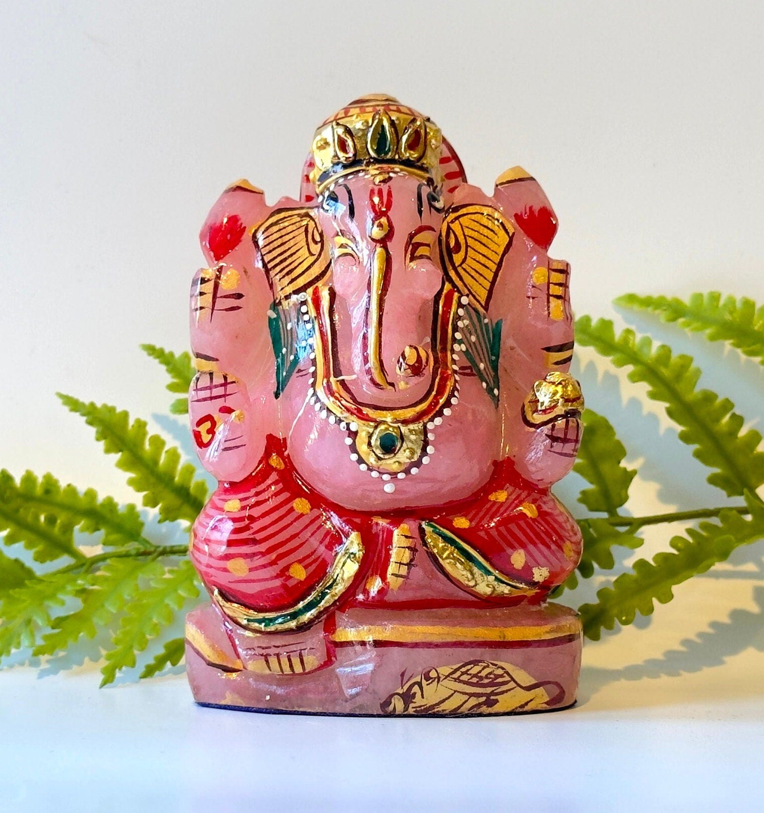 Rose quartz painted ganesha carving