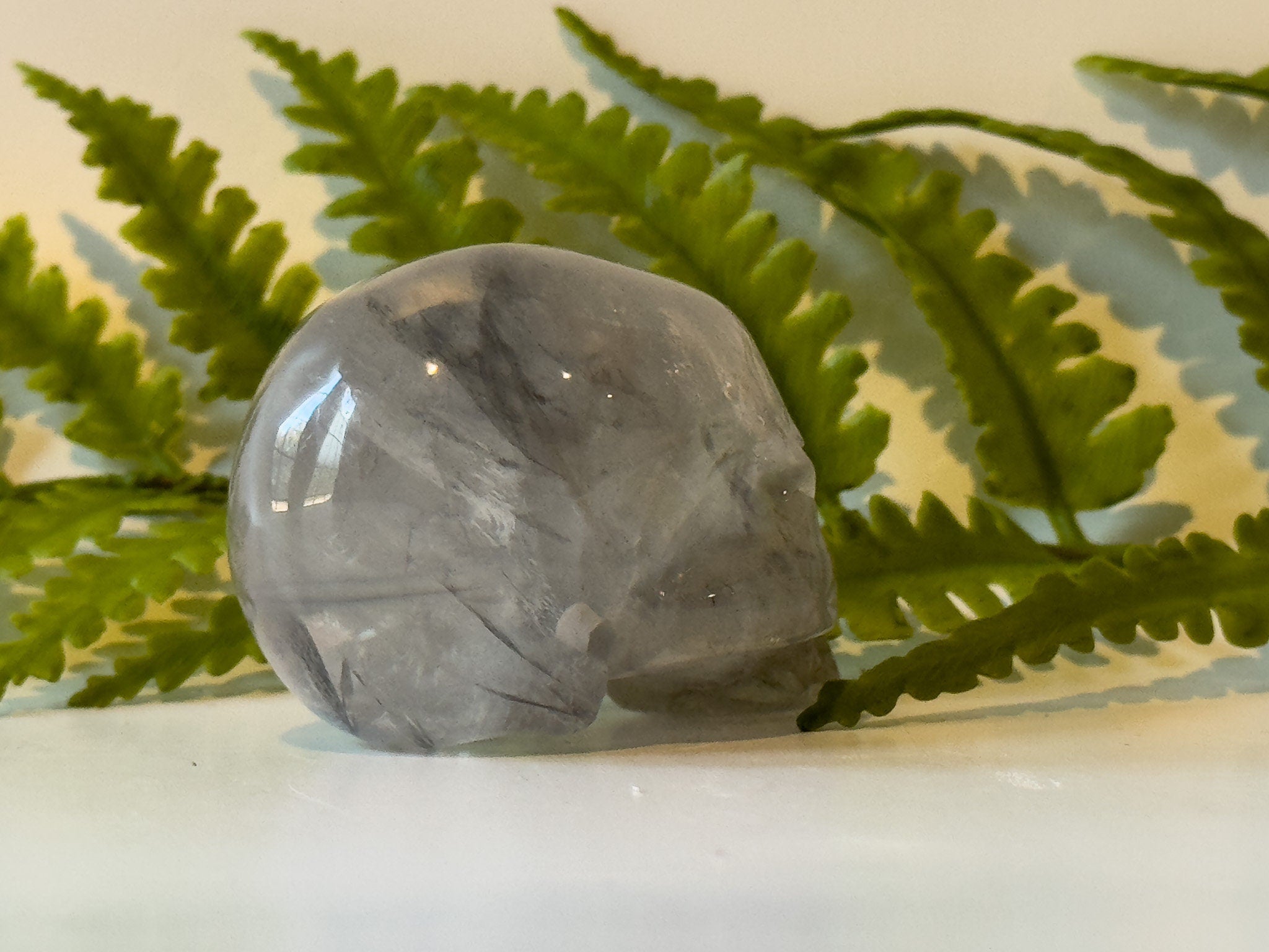 2" jawless quartz skull, detailed carve.