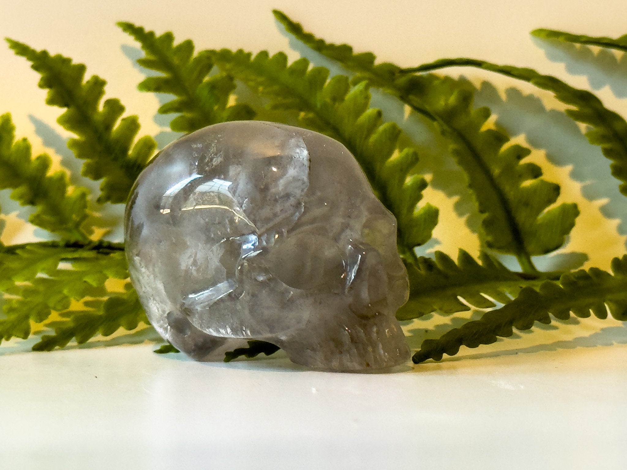 2" jawless quartz skull, detailed carve.