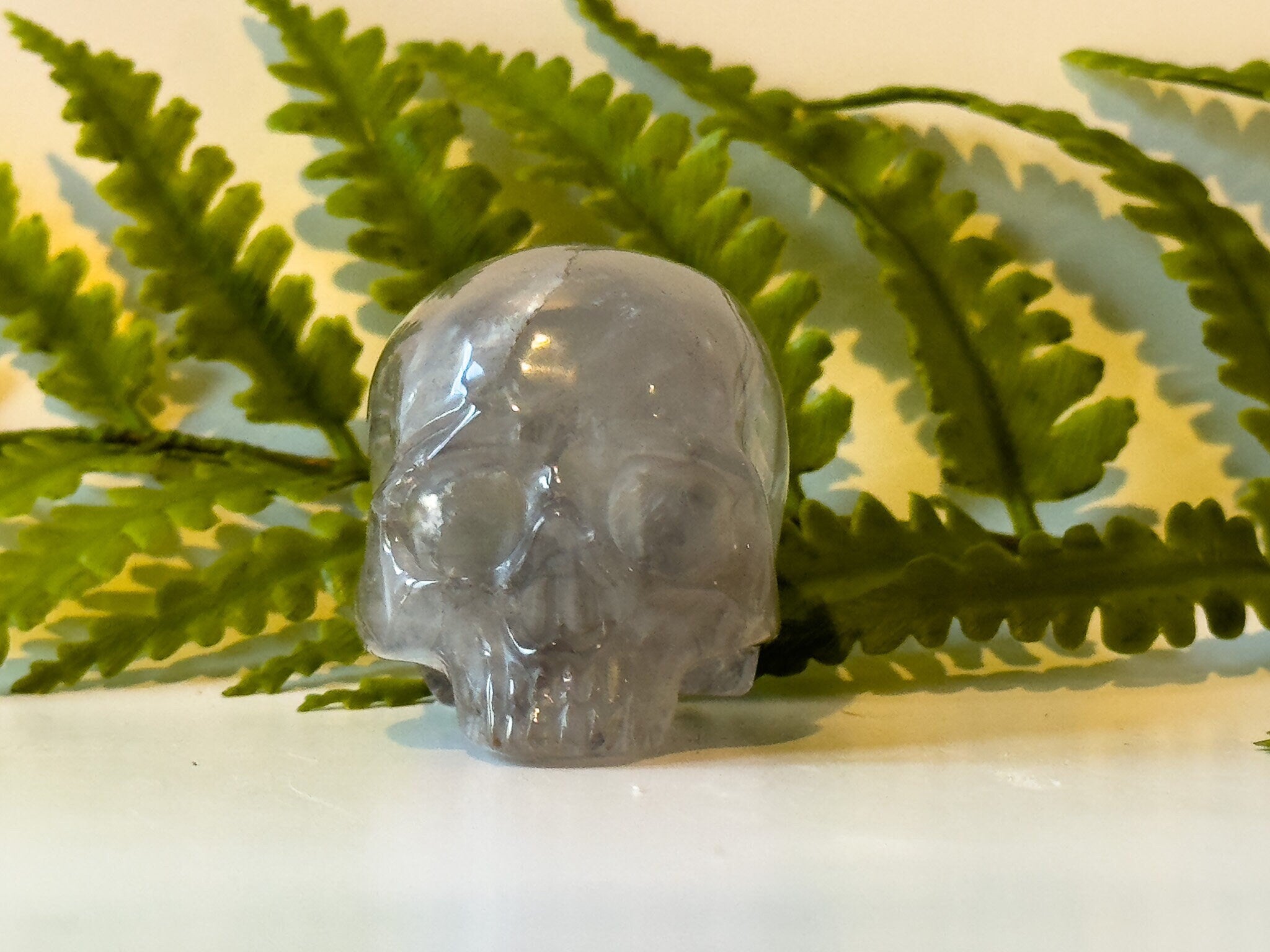 2" jawless quartz skull, detailed carve.