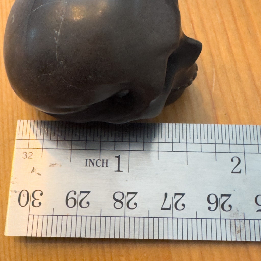 Adorable shale skull carved by Artifactual.