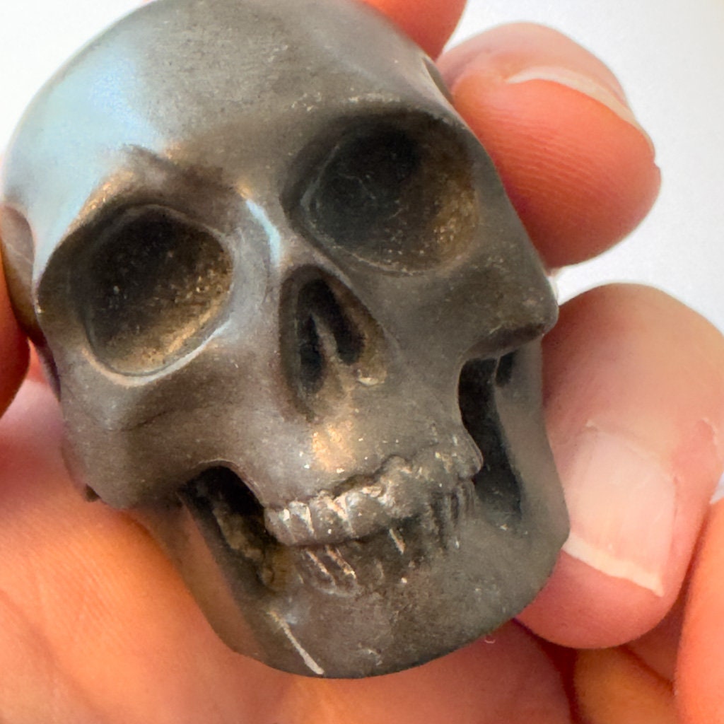 Adorable shale skull carved by Artifactual.