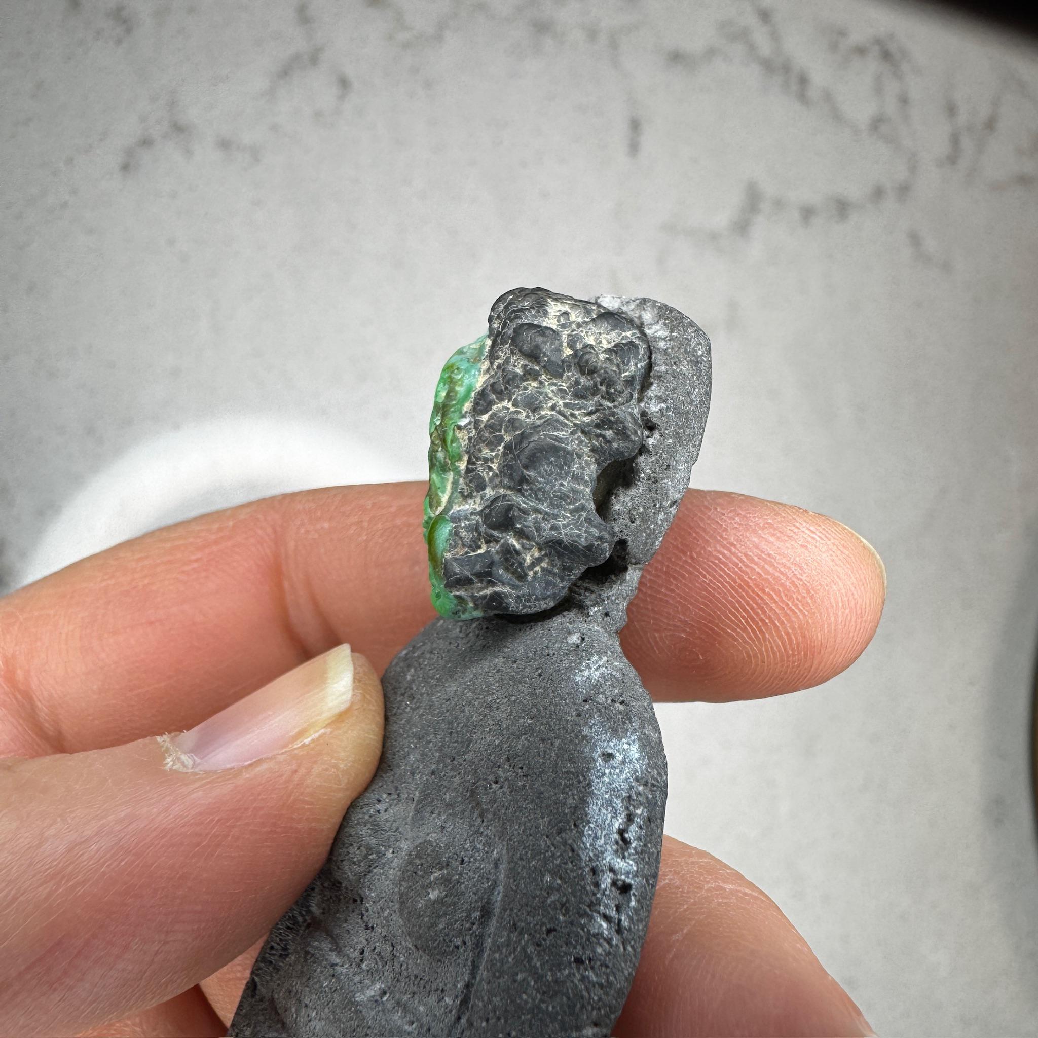 Carved balinese lava goddess with turquoise face, by Artifactual.