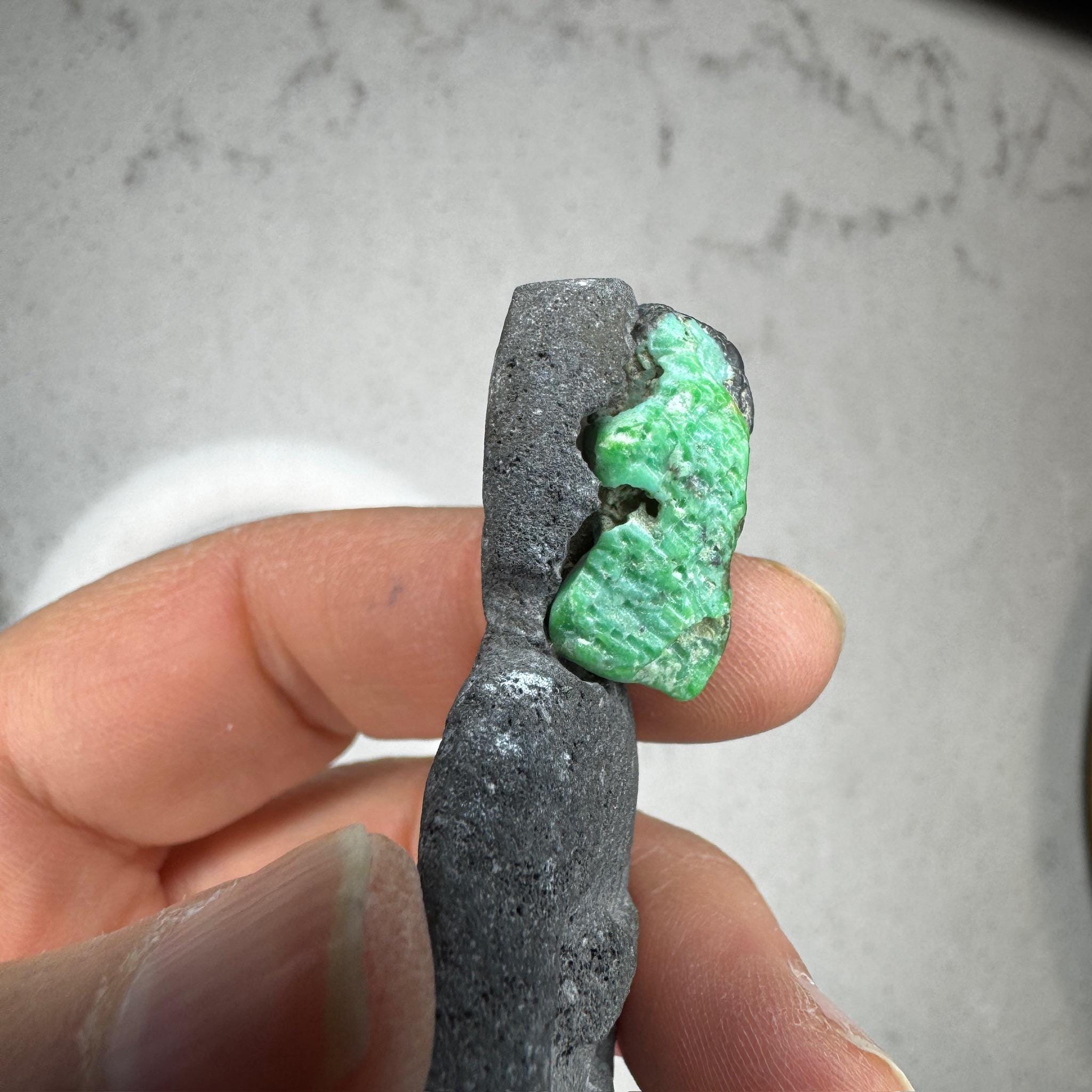 Carved balinese lava goddess with turquoise face, by Artifactual.