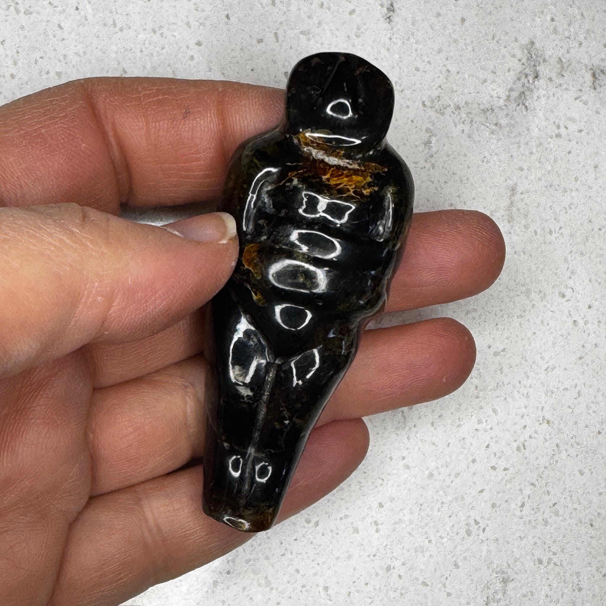 beautiful, translucent honey-colored amber carved goddess