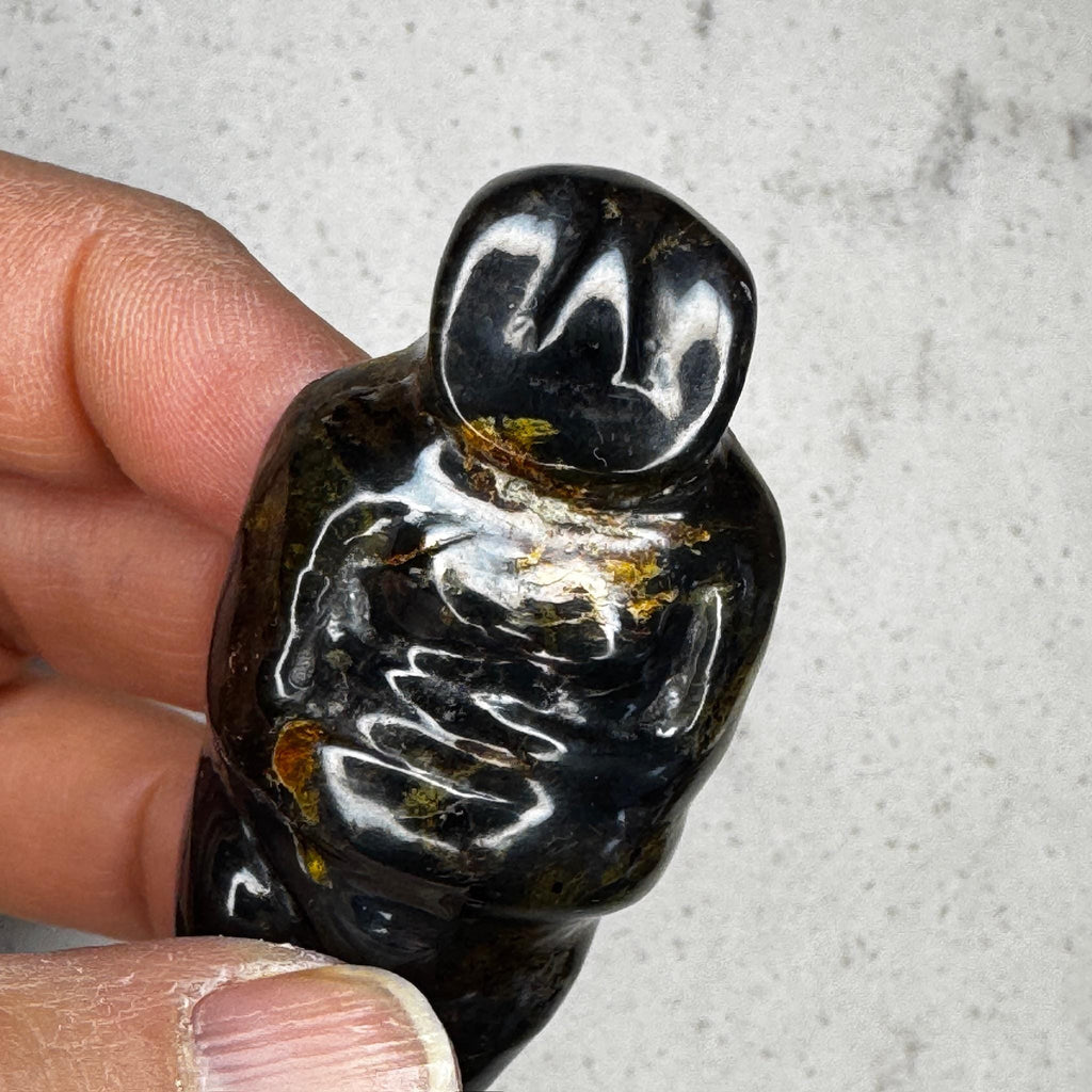 beautiful, translucent honey-colored amber carved goddess