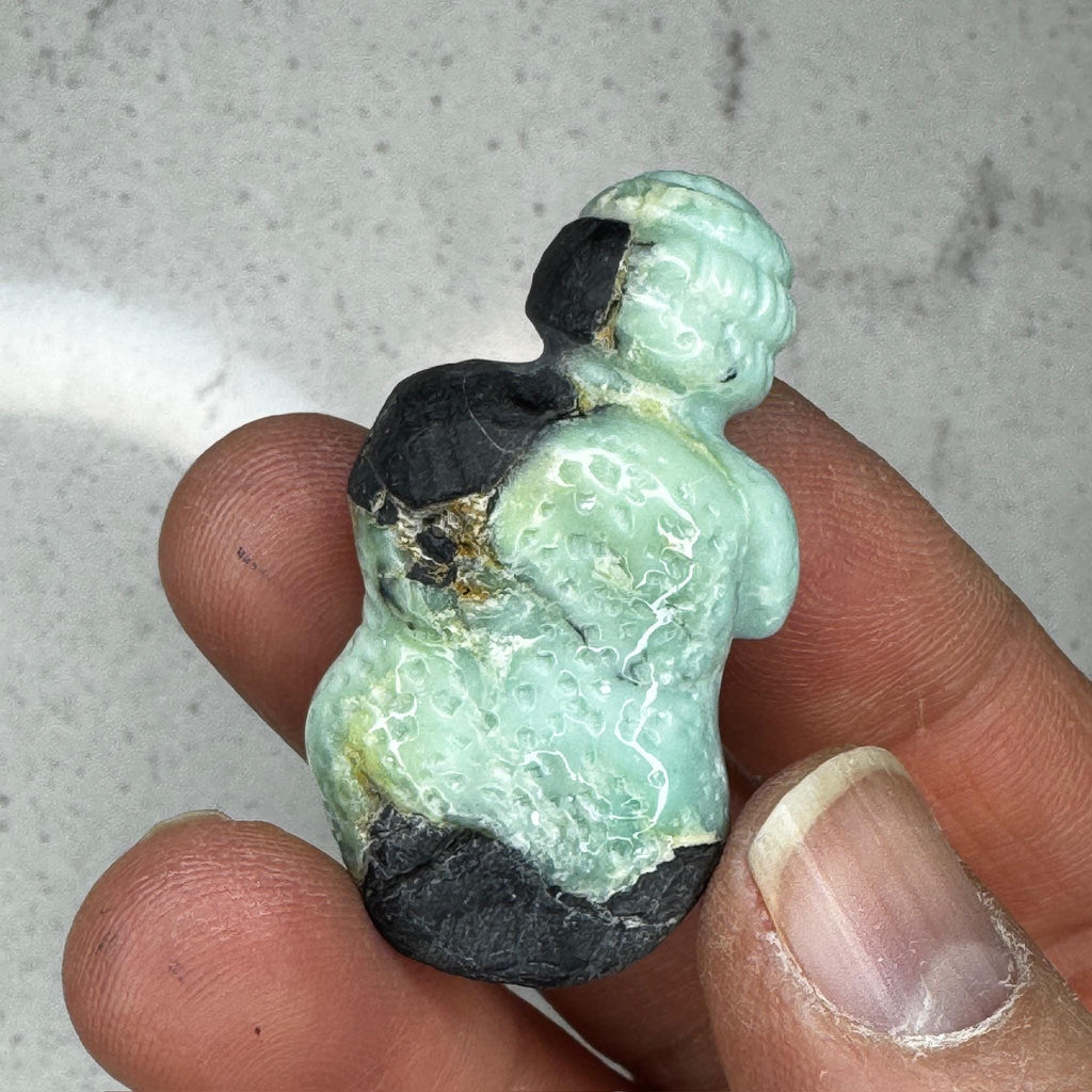 Beautiful turquoise carved goddess by Artifactual.