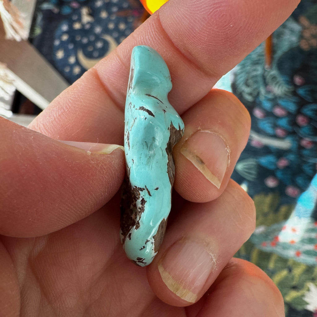 This is a stunning turquoise carved goddess we got from Artifactual