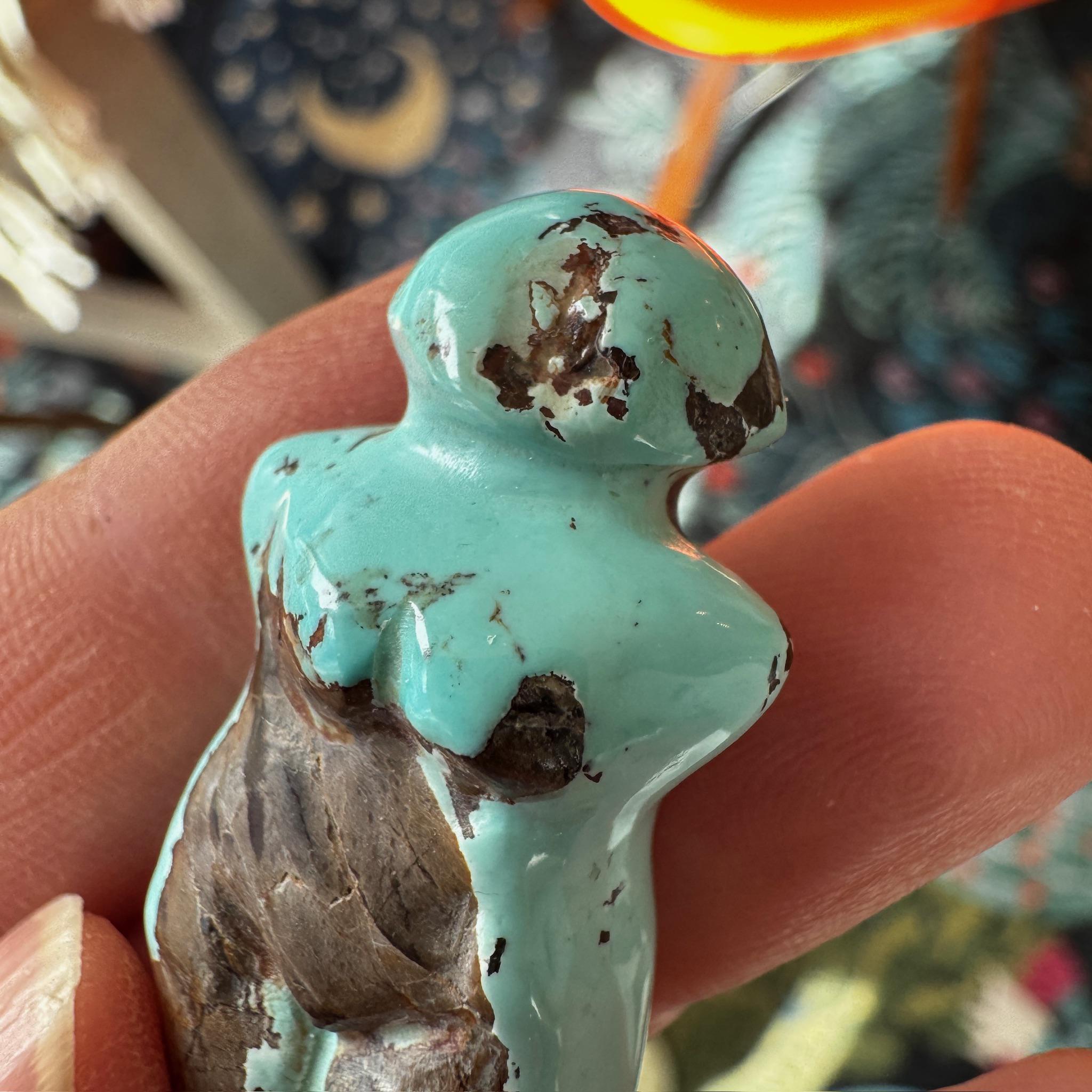 This is a stunning turquoise carved goddess we got from Artifactual