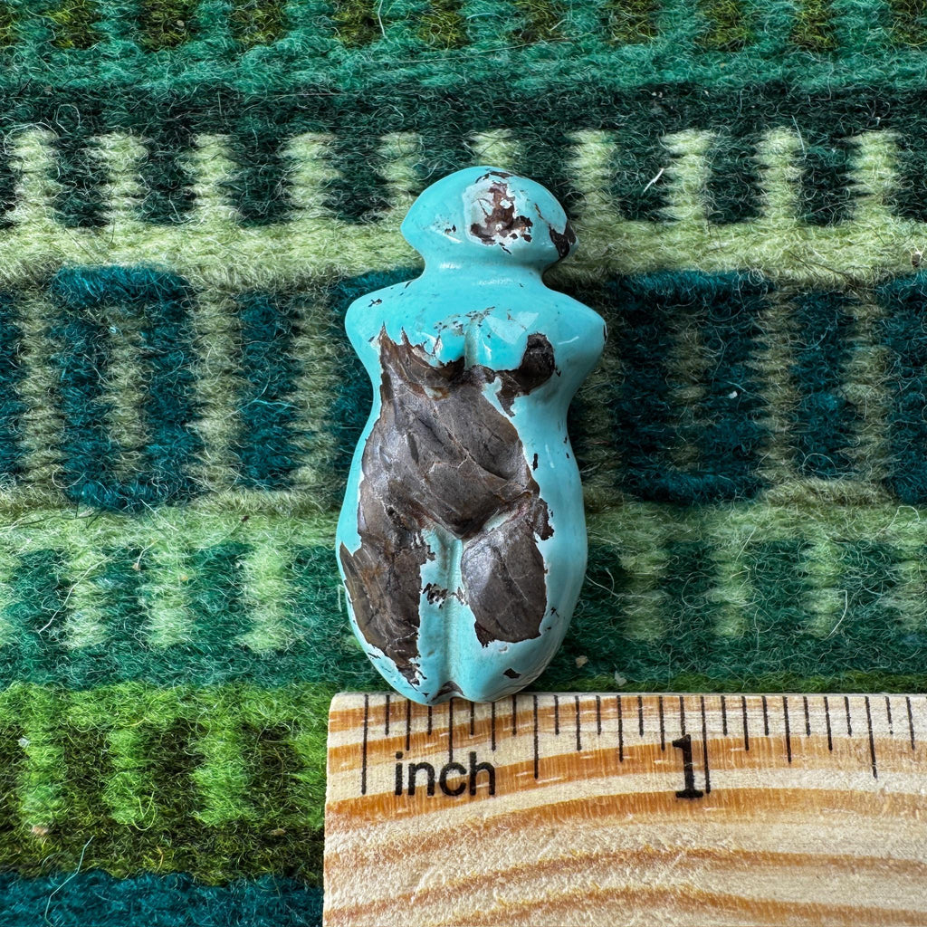 This is a stunning turquoise carved goddess we got from Artifactual