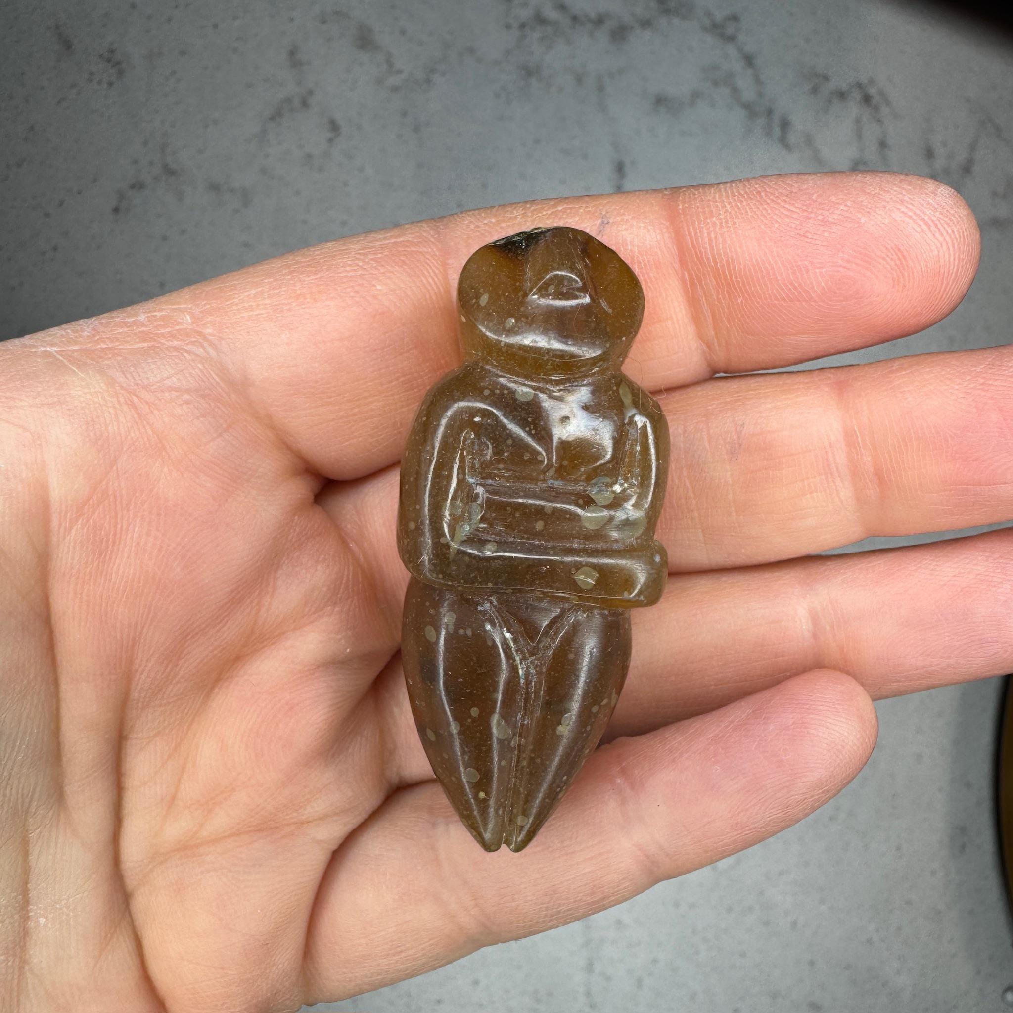 Beautiful smooth, honey amber goddess carving from Artifactual.