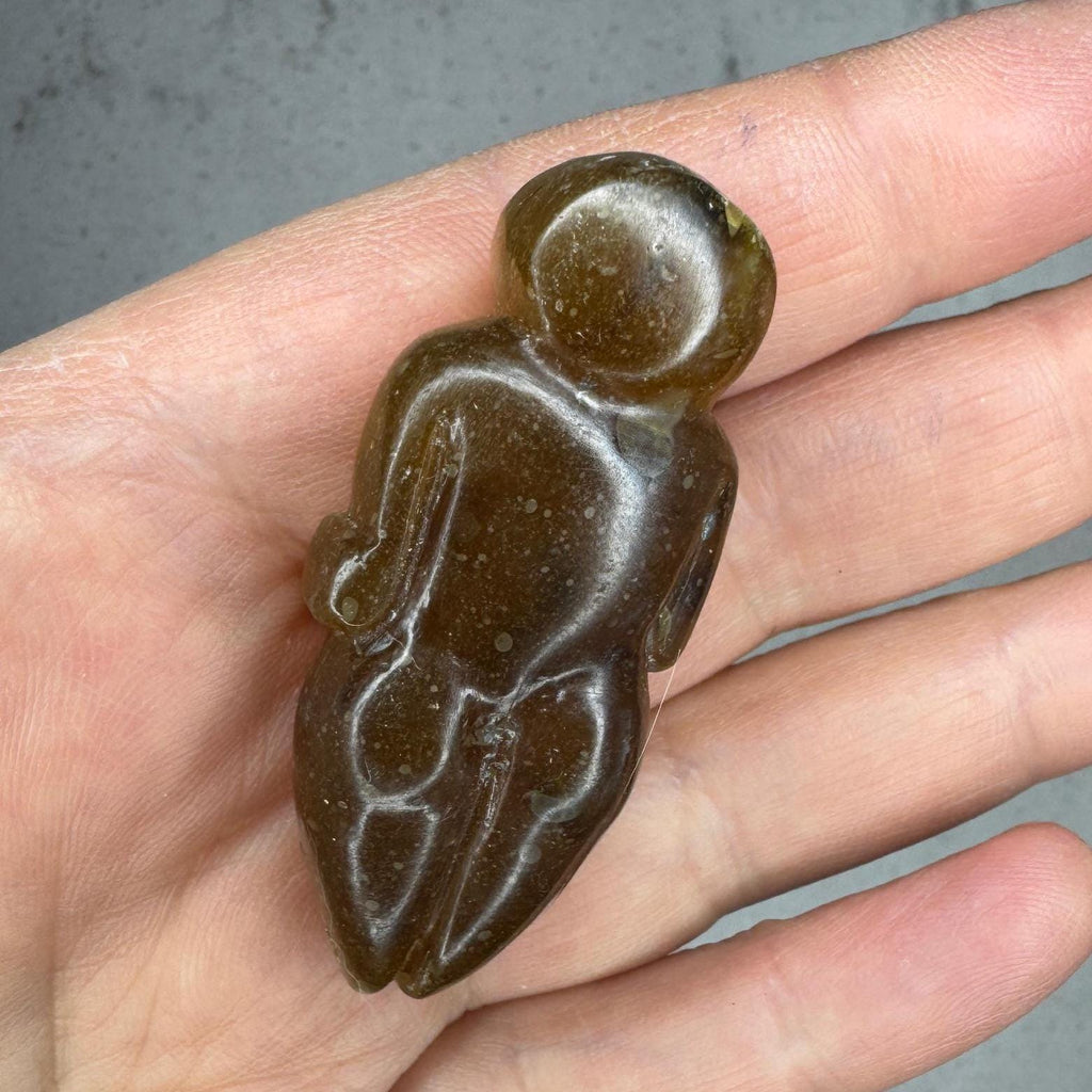 Beautiful smooth, honey amber goddess carving from Artifactual.
