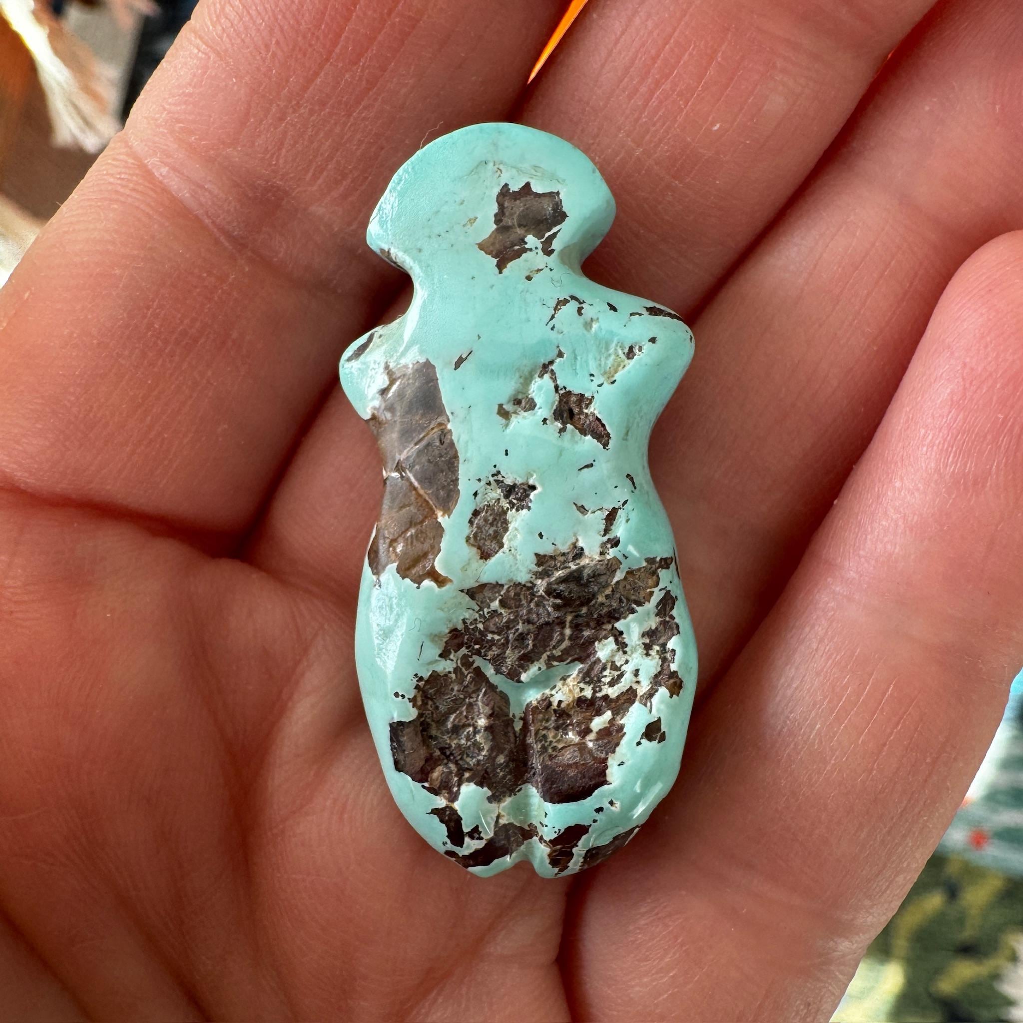 This is a stunning turquoise carved goddess we got from Artifactual