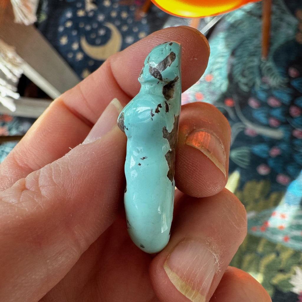 This is a stunning turquoise carved goddess we got from Artifactual